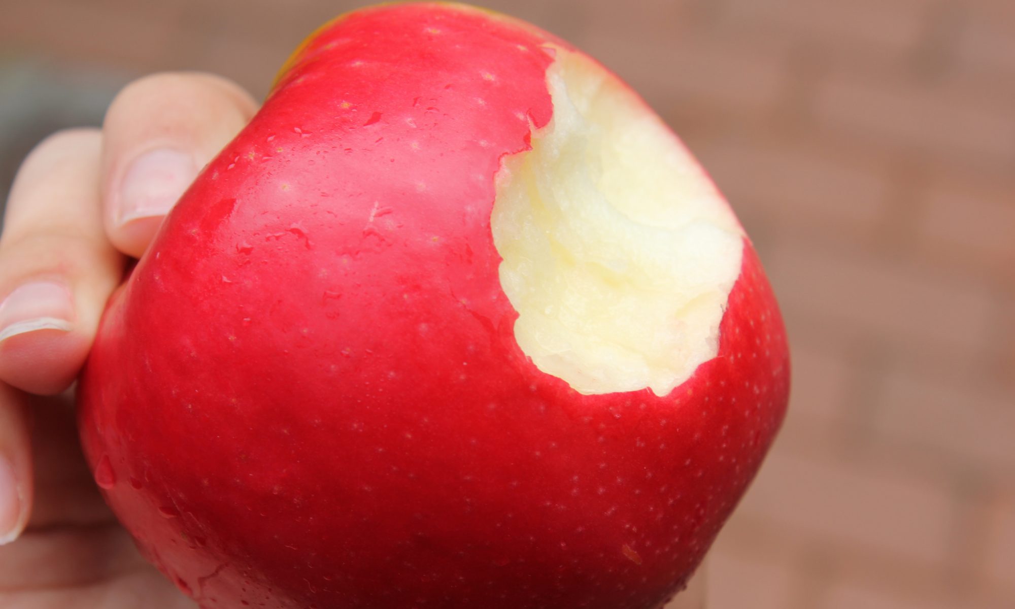 Eating a red apple